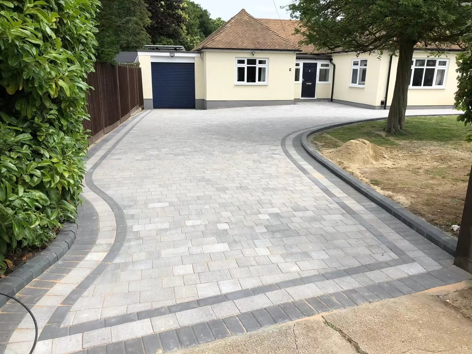 New tarmac driveway with block paved border